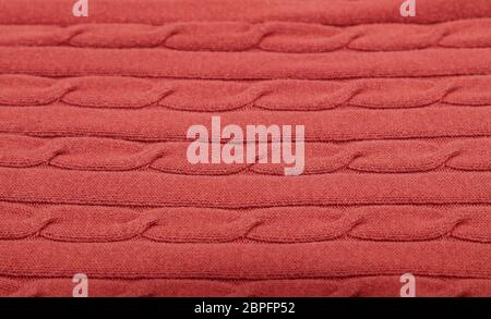 Close up background of pink red knitted wool jersey fabric texture Stock Photo