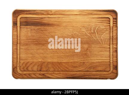 Close up of one small rectangle shaped brown used oak wood kitchen cutting board with dark burn stains and knife cut traces isolated on white backgrou Stock Photo