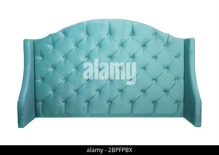 Shaped pastel teal blue color soft velvet fabric capitone bed headboard of Chesterfiels style sofa isolated on white background, front view Stock Photo