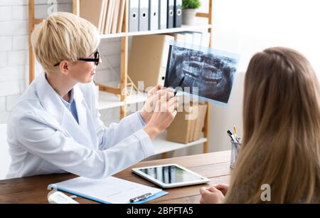 Disease treatment concept. Woman shows patient problem Stock Photo