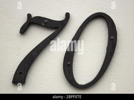 Number seventy in city street, symbol and address Stock Photo