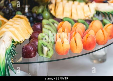 apricots plums pineapple and kiwi Stock Photo