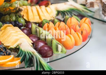 apricots plums pineapple and kiwi Stock Photo