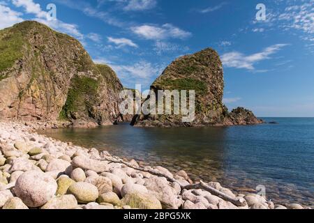 Bullers of Buchan refers to a collapsed sea cave situated about 6 miles south of Peterhead in Buchan, Aberdeenshire, Scotland. Stock Photo
