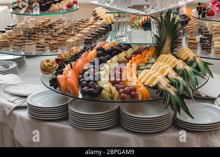 apricots plums pineapple and kiwi Stock Photo