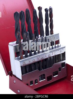 Old drill bit set in red box Stock Photo