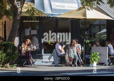 Sydney, Australia. Tuesday 19th May 2020. People enjoying cafe life again at Fiveways, Paddington in Sydney's eastern suburbs. Since May 15th Cafes, restaurants, and hotel dining areas are able to reopen but can only serve 10 guests at a time as the coronavirus pandemic restrictions ease. Credit Paul Lovelace-Alamy Live News Stock Photo