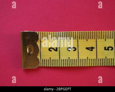 a ruler with metric units, over red background Stock Photo