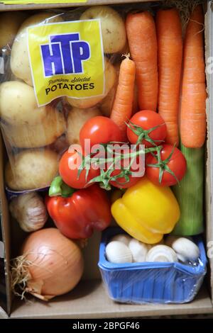 Boxes of emergency food delivery from restaurant suppliers who are unable to deliver to restaurants during the pandemic covid-19 so now delivering to the public homes Stock Photo