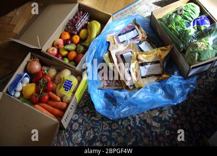 Boxes of emergency food delivery from restaurant suppliers who are unable to deliver to restaurants during the pandemic covid-19 now delivering to Stock Photo