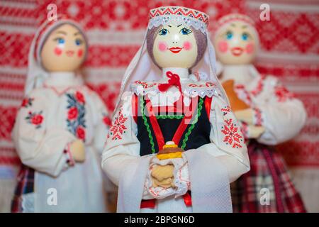 Slavic national dolls. Belorussian Ukrainian Russian ethnic dolls. Lyalka in an embroidered shirt with bread and salt. Stock Photo