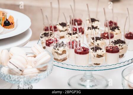 Set of different cakes sweets and desserts arranged on one plate. Party candy bar Stock Photo