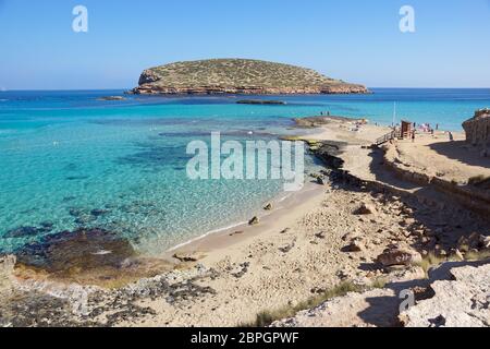 Beautiful sandy Cala Comte beach with azure blue sea water, Ibiza island, Stock Photo