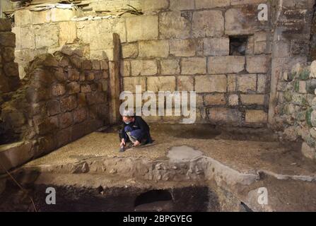 Jerusalem, Israel. 19th May, 2020. Israeli archaeologist Tehila Sadiel cleans a mosaic floor unearthed by the Israel Antiquities Authority on Tuesday, May 19, 2020, in the Old City of Jerusalem. Archeologists have discovered an unique subterranean system in the bedrock of the Second Temple Period beneath a 1400 year-old public building in the underground excavations under the Western Wall. Photo by Debbie Hill/UPI Credit: UPI/Alamy Live News Stock Photo