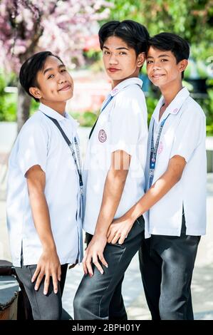 Playful Filipino school children pose in a park in Angeles City, The Philippines, South East Asia. Stock Photo