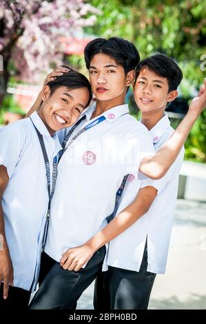 Playful Filipino school children pose in a park in Angeles City, The Philippines, South East Asia. Stock Photo