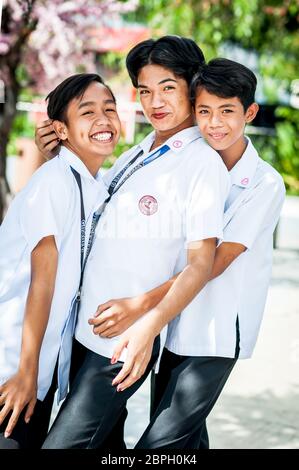 Playful Filipino school children pose in a park in Angeles City, The Philippines, South East Asia. Stock Photo