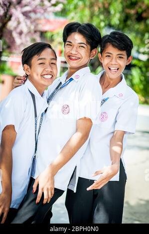 Playful Filipino school children pose in a park in Angeles City, The Philippines, South East Asia. Stock Photo