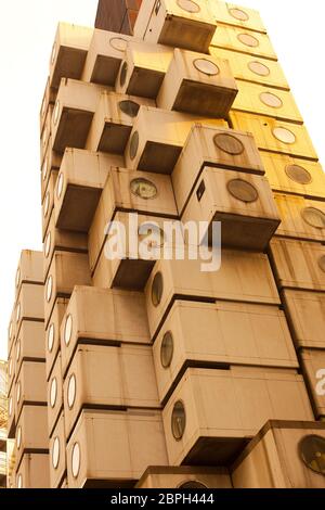 Shiodome Area, Shimbashi, Tokyo, Kanto Region, Honshu, Japan - The avant-garde architecture of Nakagin Capsule Tower. Stock Photo