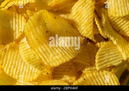 crispy potato chips close-up. edible background. corrugated chips structure Stock Photo