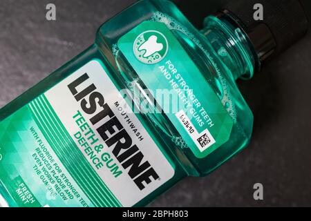 LONDON - MAY 16, 2020: Listerine mouthwash in green plastic bottle Stock Photo