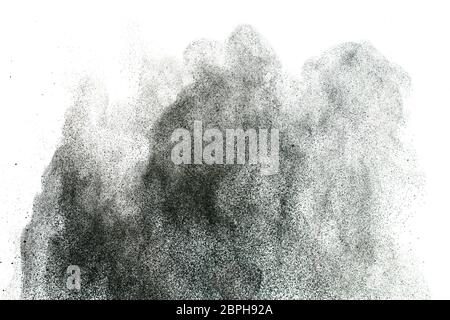 Black powder splatter background.Dust particles texture. Grunge urban backdrop. Stock Photo