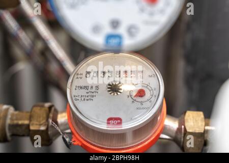 plumbing cabinet. turn off hot or cold water. close-up of hot water meter Stock Photo
