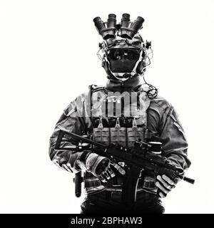 Half length studio portrait of anti-terrorist squad fighter, special operations soldier, military company mercenary in tactical ammunition with night Stock Photo
