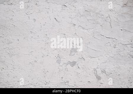 Stucco on the wall in white. Background texture of painted old wall. Stock Photo