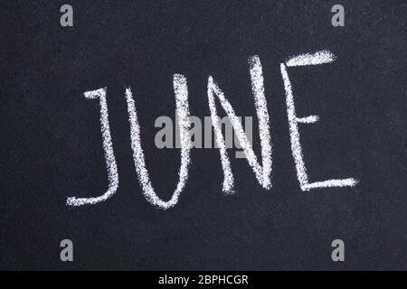 Blackboard with June inscription on blackboard background Stock Photo