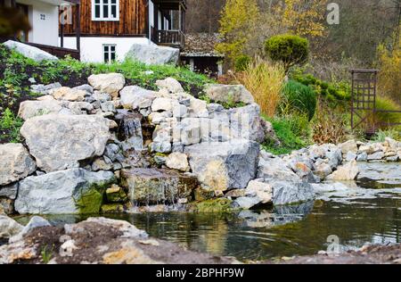 Mountain Stream In Landscape Design Near A Beautiful House Or Cottage In The Hill Autumn Time Garden In Autumn Colors In A Mountain Landscape Stock Photo Alamy