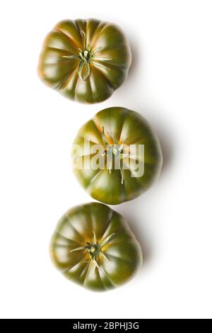 Dark brandywine tomatoes isolated on white background. Stock Photo