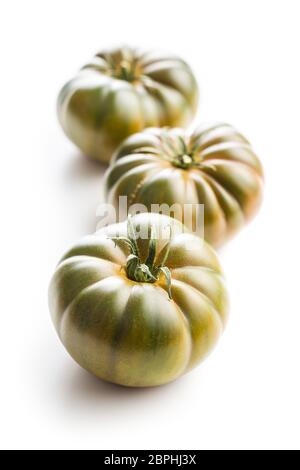 Dark brandywine tomatoes isolated on white background. Stock Photo