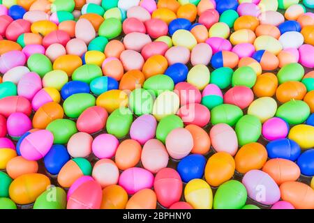 The Colorful easter eggs,Colorful plastic eggs toys floating on the water background Stock Photo