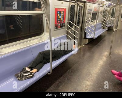 Sleeping in an almost empty New York City subway car Stock Photo - Alamy