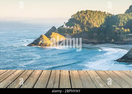 empty wooden deck table top Ready for product display montage with scenic view of the coast beach in the morning background.  . Stock Photo