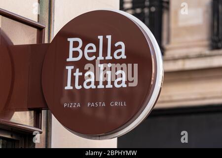 London, UK. 19th May, 2020. Bella Italia restaurant company logo seen at the Strand, London.The owner of the Bella Italia and Café Rouge restaurant chains has said it is considering administration as the coronavirus crisis pushes the struggling business near to collapse, putting 6,000 jobs at risk. Credit: SOPA Images Limited/Alamy Live News Stock Photo