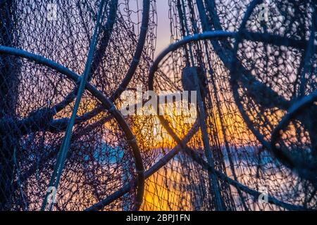 A fish trap is a stationary trap used for fishing. Stock Photo