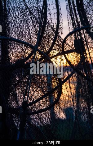 A fish trap is a stationary trap used for fishing. Stock Photo