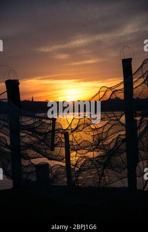 A fish trap is a stationary trap used for fishing. Stock Photo