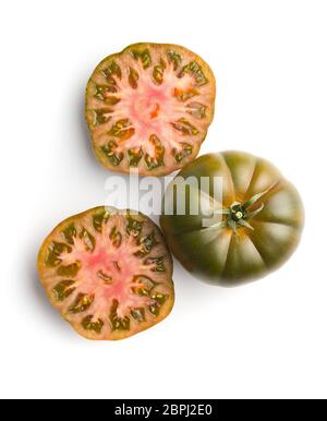 Dark brandywine tomatoes isolated on white background. Stock Photo