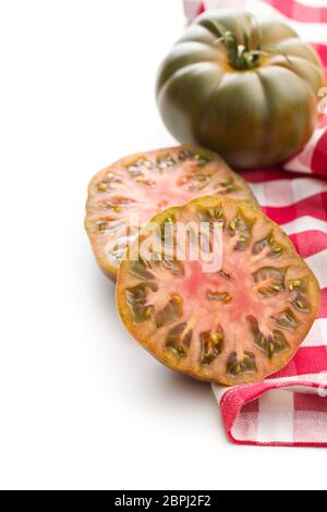 Dark brandywine tomatoes isolated on white background. Stock Photo