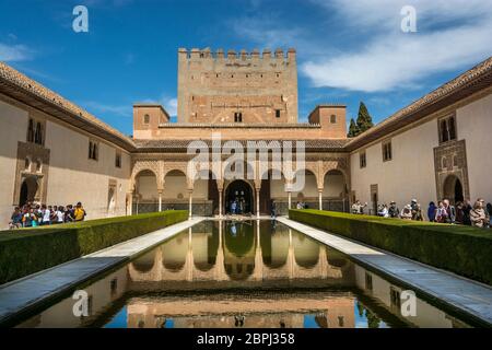 The Court of the Myrtles (Patio de los Arrayanes) with the Torre de Comares in the Nasrid Palaces complex, part of Alhambra Palace, Granada, Spain. Stock Photo