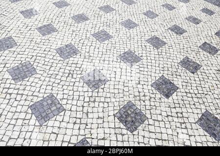 Typical stone floor Lisbon, detail of a typical floor with shapes and drawings, art Portugal, tourism Stock Photo