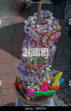 colorful crowns  for sale made of fake flowers Stock Photo