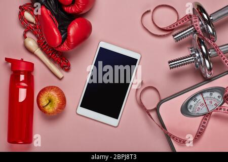 Female fitness still life. Boxing gloves and scales on pink background.  Mockup. Planning of diet and trainings. Top view with copy space. Healthy  lif Stock Photo - Alamy