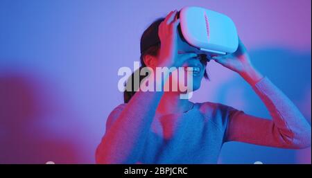 Woman watching with VR device Stock Photo