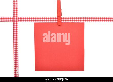 Checked ribbon and paper on white background Stock Photo
