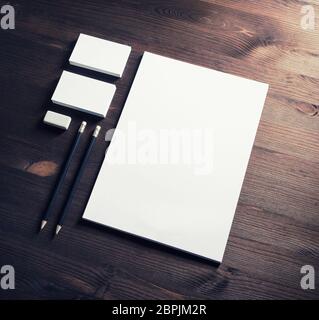 Corporate stationery template. Blank letterhead, business cards, pencils and eraser. Branding mock-up. Stock Photo