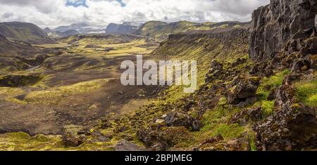 Rocky volcanic nature landscape of Landmannalaugar in Iceland on Laugavegur trek. Green Nordic summer on hiking trail. Stock Photo